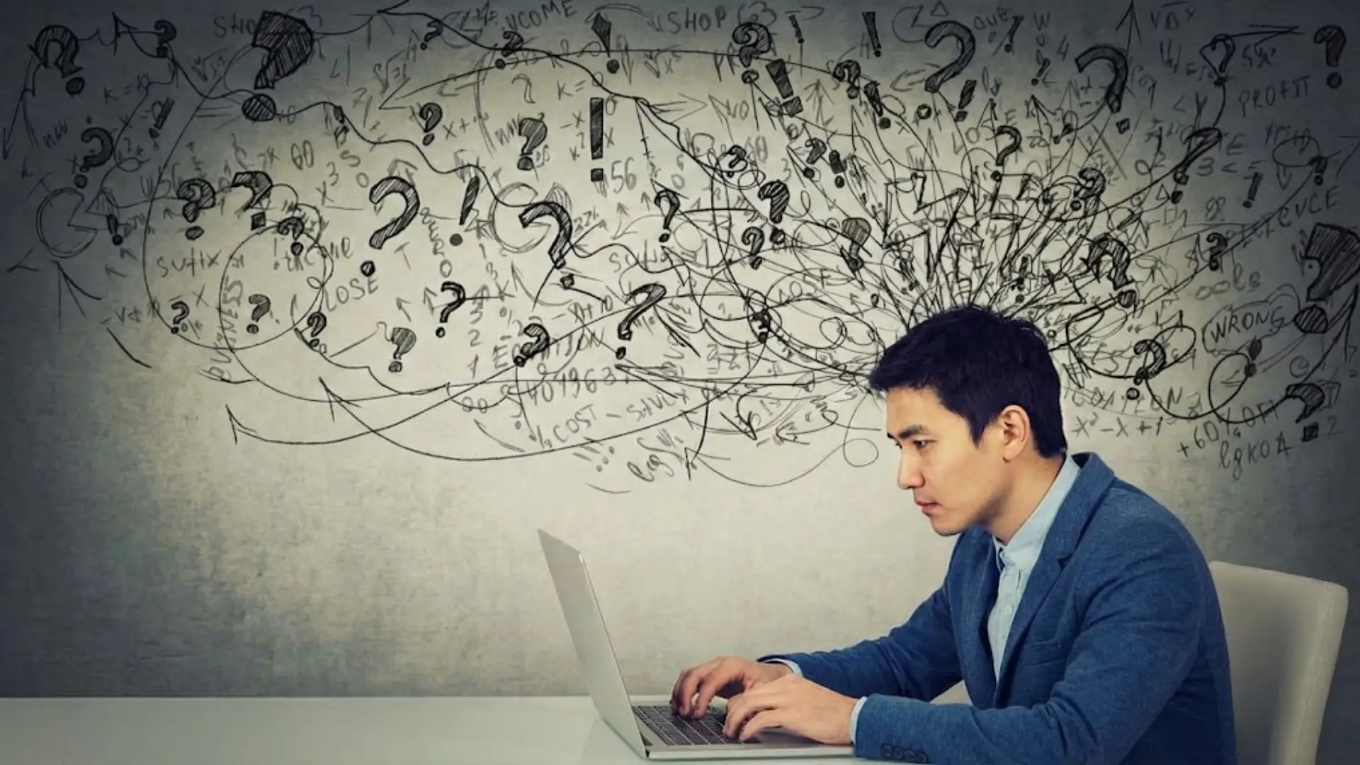 Person working on laptop with chaotic cloud of scribbles, question marks, arrows, and math symbols emerging from head, symbolizing cognitive overload.